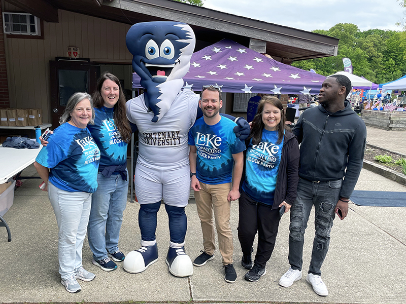 People stand around the Centenary University Cyclone