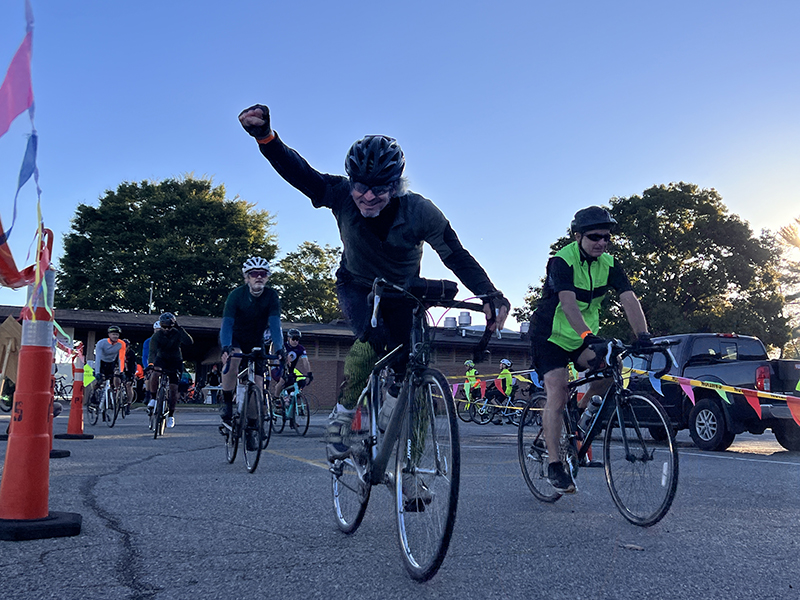 Randy rides a bicycle