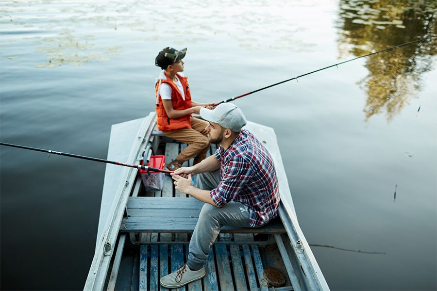 Two people fishing on a boat