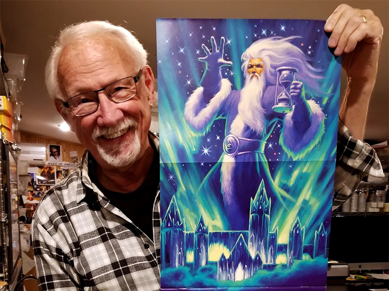 Greg Hildebrandt with a piece of his artwork.