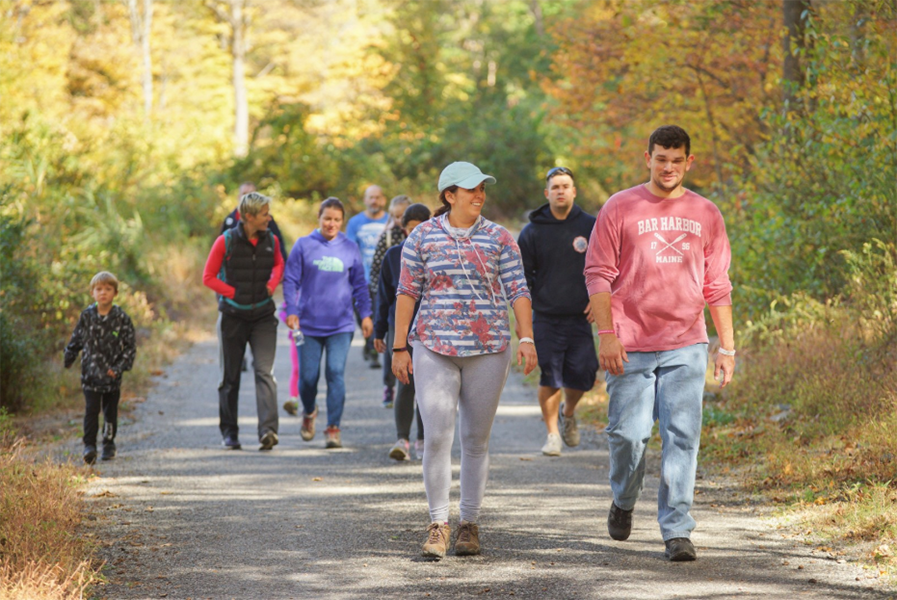 People hike on the Hudson Farm Hike.