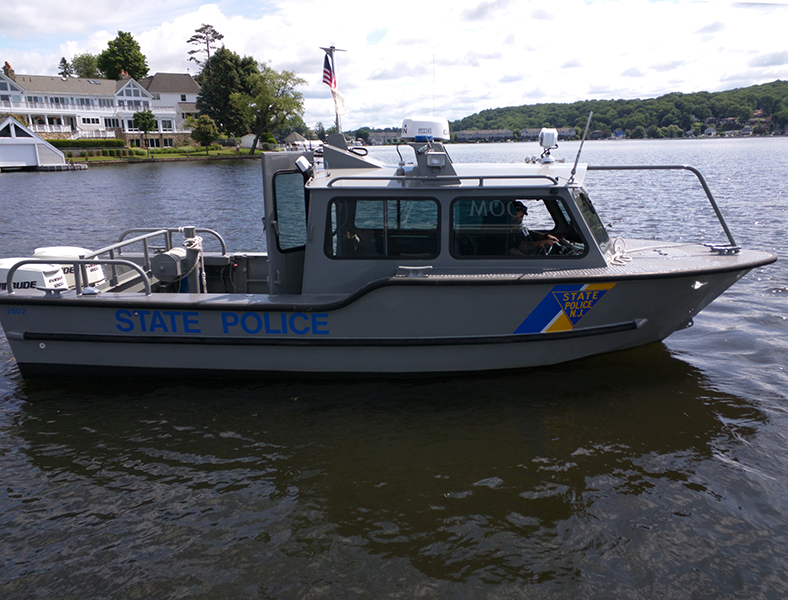 A marine police boat floats in Lake Hopatcong.