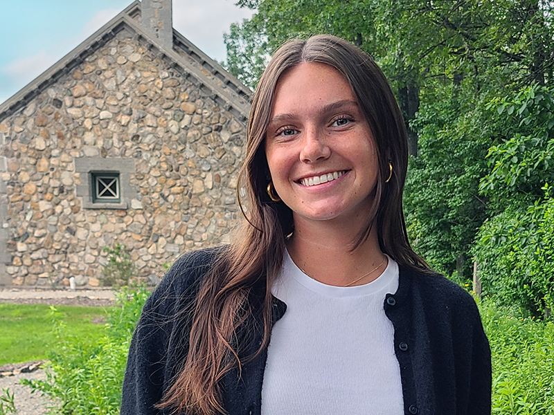 A picture of Sarah Allen, our summer intern, standing in front of the Lake Hopatcong Foundation Station.